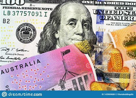 An Australian One Dollar Bill with a an American One Hundred Dollar Bill Stock Photo - Image of ...