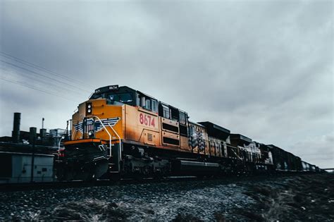 Orange Train on Rail Road · Free Stock Photo