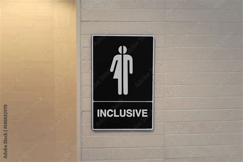 Gender neutral restroom sign that says, INCLUSIVE Stock Photo | Adobe Stock