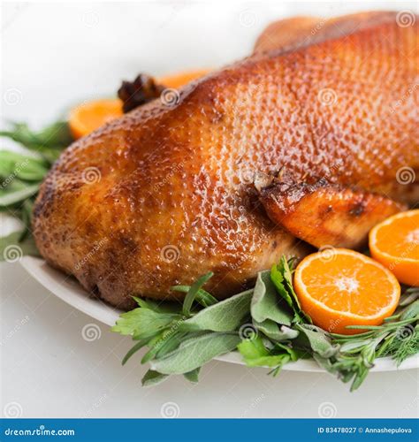 Roasted Duck in Honey Glaze with Spicy Herbs and Tangerines Stock Image - Image of glaze ...