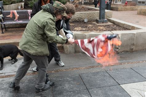 Iowa City man attempts to burn a flag in protest of Trump inauguration ...