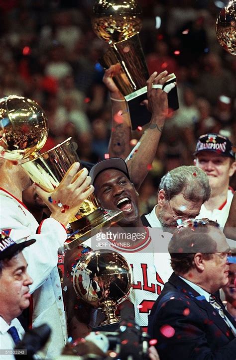 Chicago Bull player Michael Jordan is surrounded by NBA Championship... | Michael jordan ...