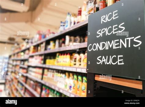 Rice, spices, condiments, sauces grocery categoy aisle at supermarket ...