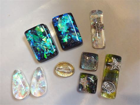 These are some of the epoxy resin pendants I made using cellophane glitter and nail polish ...