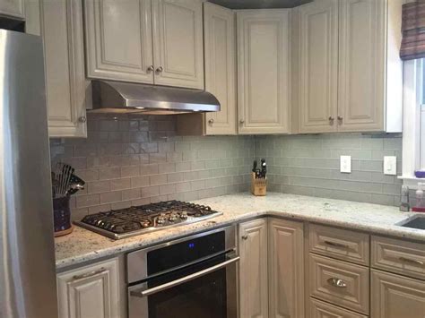 white cabinets with black backsplash decorations inspiring also upper corner ki… | Glass tile ...