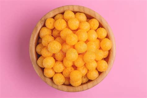 Cheese Puff Balls In Wooden Bowl On Bright Colorful Background Stock ...