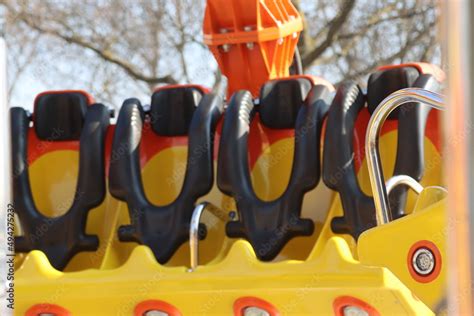 amusement park carousel with funfair seats - Stock Photo | Adobe Stock