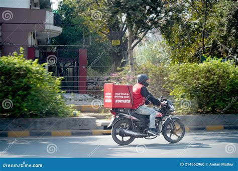 Zomato Delivery Boy with Red Hot Box for Food on a Bike Zooming at High ...