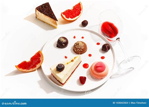 Gourmet Desserts and Grapefruit Slices on a White Plate. Top View Stock ...