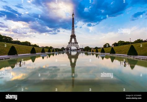 Eiffel tower by seine river against blue sky at sunset hi-res stock photography and images - Alamy