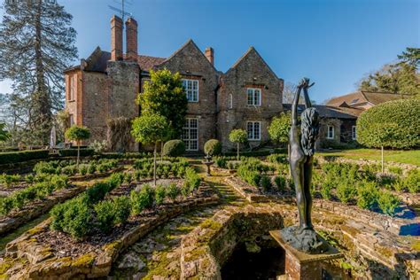 A historic manor house with a lake and four acres of landscaped gardens ...