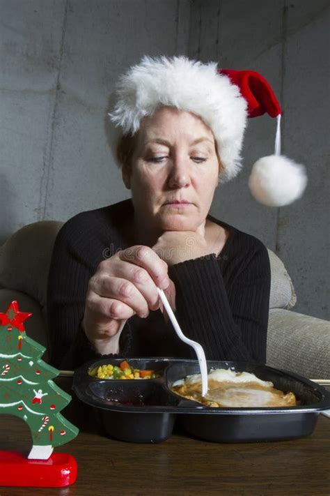 Sad Woman Eating Christmas Dinner Alone Stock Photo - Image: 49214271