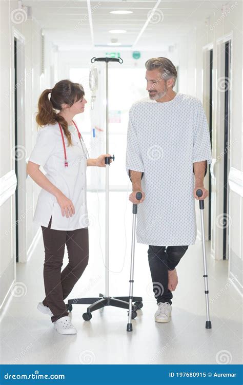 Patient Using Cane while Looking at Female Doctor Stock Image - Image ...