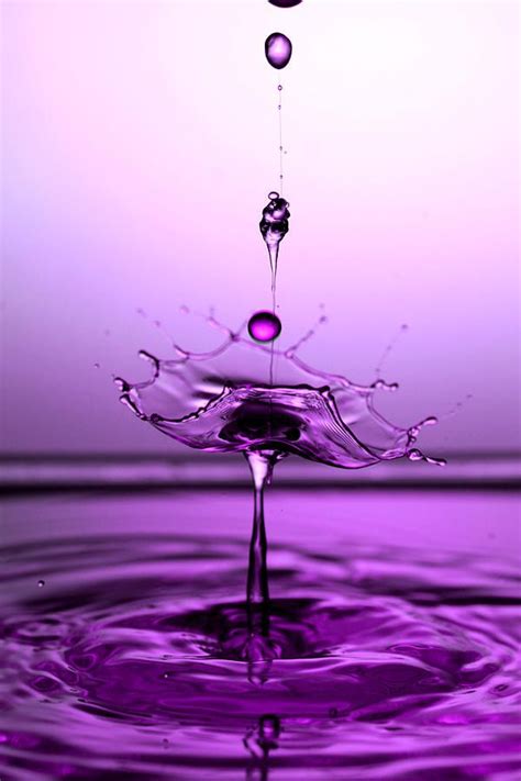purple water splashing on the surface with words that read,'purple'above it