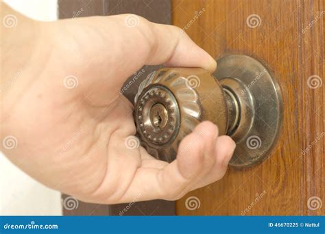 Closeup Of Male Hand Opening Door Knob Stock Photo - Image: 46670225