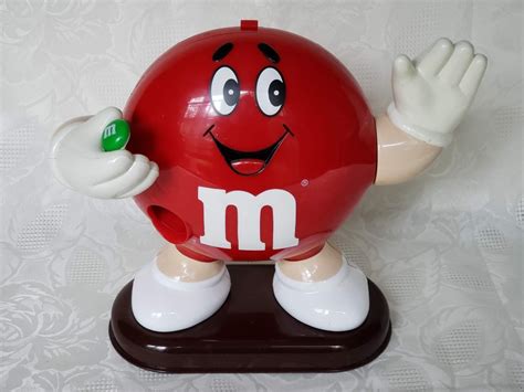 Red M&M Candy Dispenser with Waving Hand – SOLD – Aunt Gladys' Attic