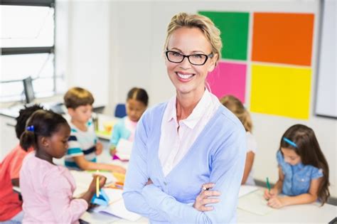 Premium Photo | Portrait of teacher standing in classroom