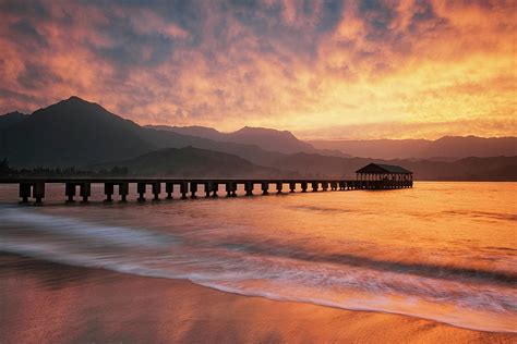 Spectacular sunset fills the sky over Hanalei Bay. Photograph by Larry Geddis - Fine Art America