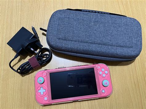 Nintendo Switch Lite (Coral Pink), Video Gaming, Video Game Consoles, Nintendo on Carousell