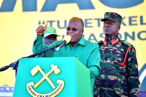 ) Tanzania's President John Pombe Magufuli addresses residents during a ...