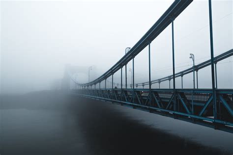 Gray Bridge Above River during Dusk · Free Stock Photo