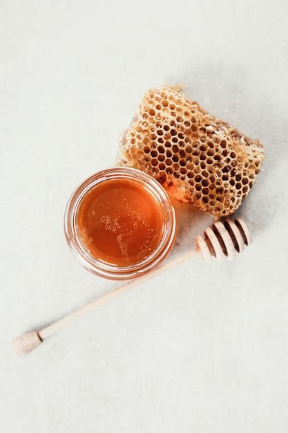 Free Photo | Honeycomb with jar