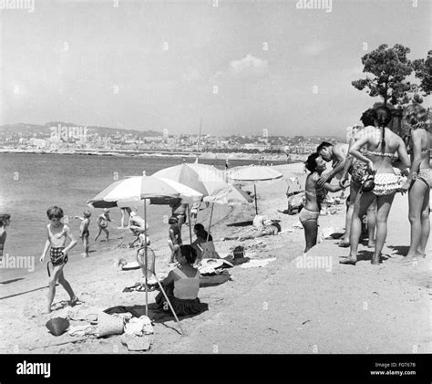 Cannes people on the beach 1960s Black and White Stock Photos & Images ...