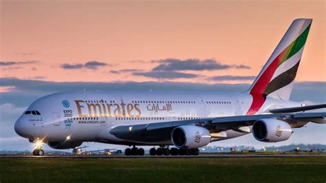 Download Majestic Emirates Airbus A380 Soaring in the Sky Wallpaper | Wallpapers.com