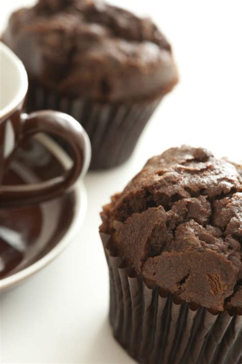 Freshly baked chocolate muffins with coffee cup - Free Stock Image