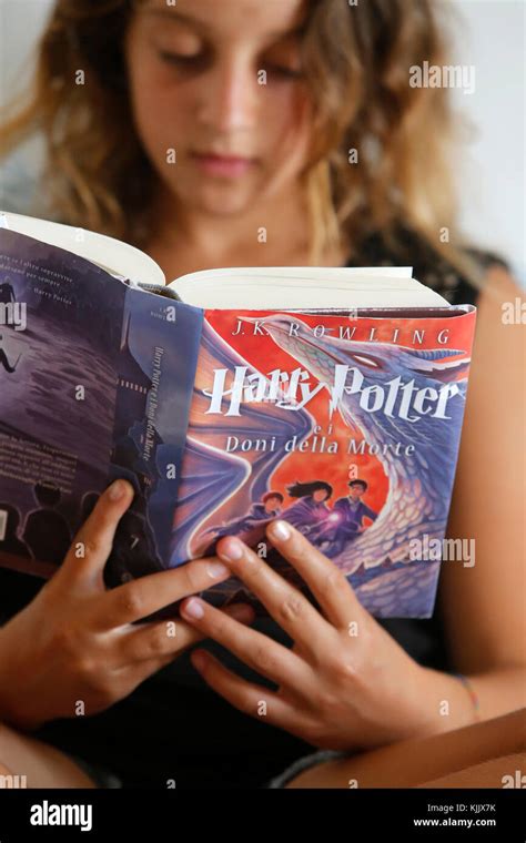 Teenager reading Harry Potter Stock Photo - Alamy