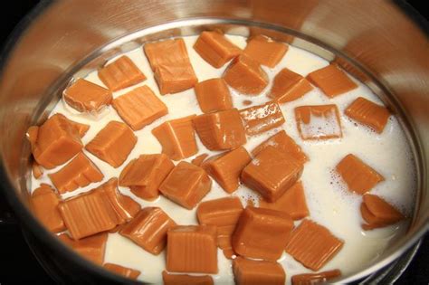 a pan filled with milk and caramel cubes