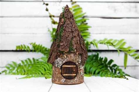 Handmade fairy house log house with bark roof and moss. Made by Jaccob McKay. It even opens up ...