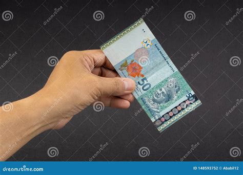 Hand Holding Malaysia Ringgit MYR Currency Bank Notes. Stock Photo - Image of loan, economy ...