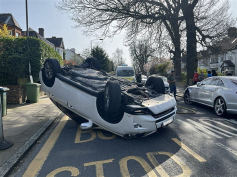 Plumstead driver escapes unhurt as car flips onto roof - BBC News