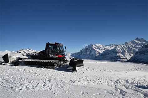 Pistenbully Grooming Slopes on a Sunny Day in Switzerland, Bernese Oberland Editorial Stock ...