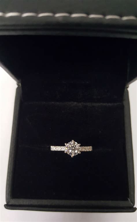 Solitaire diamond ring with shoulder side diamond in 18karat white gold ...