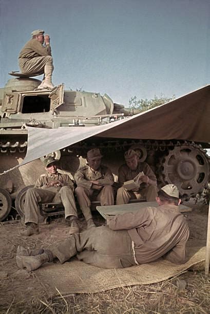 German tankers taking a break next to their tank in North Africa. Date ...