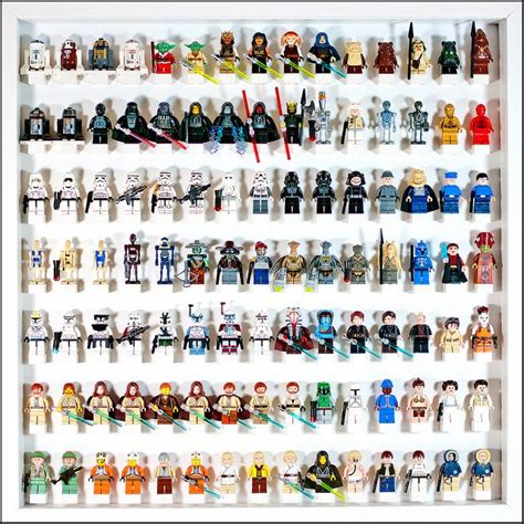 lego star wars minifigurs are arranged on a white shelf with black trim