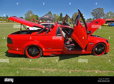 holden ss ute wth gullwing doors, in red, heavily customized at 'glen on wheels' car festival in ...