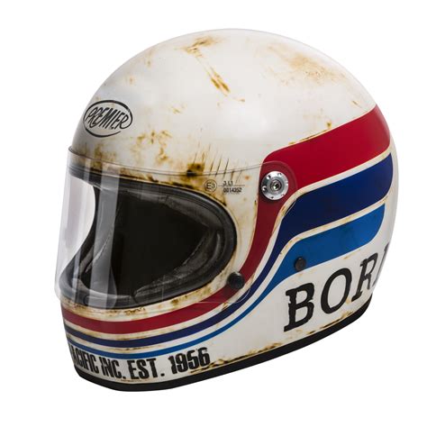 an old helmet is worn and rusted on to it's side, with the word bob written in red white and blue
