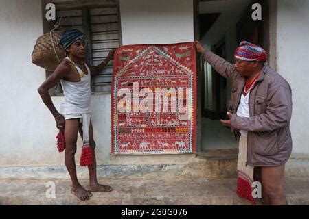 LANJIA SAORA TRIBE. Idital painting on wall of house. Idital paintings are made with rice powder ...