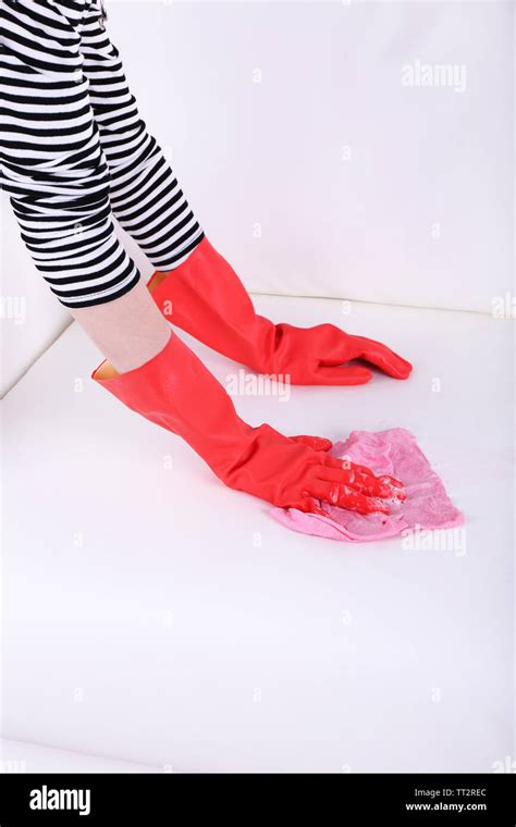 Cleaning white sofa Stock Photo - Alamy