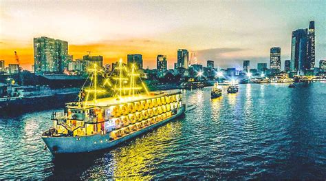 Diner cruise on the Saigon River with views over the sky line ...