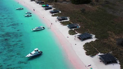 Aerial orbiting view of pink beach in Komodo 30469400 Stock Video at Vecteezy