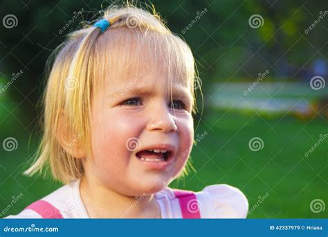 Sad little girl crying stock image. Image of outside - 42337979