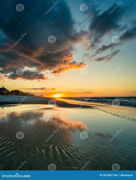 A Beautiful Beach is at Sunset with the Sun Shining Brightly Stock ...