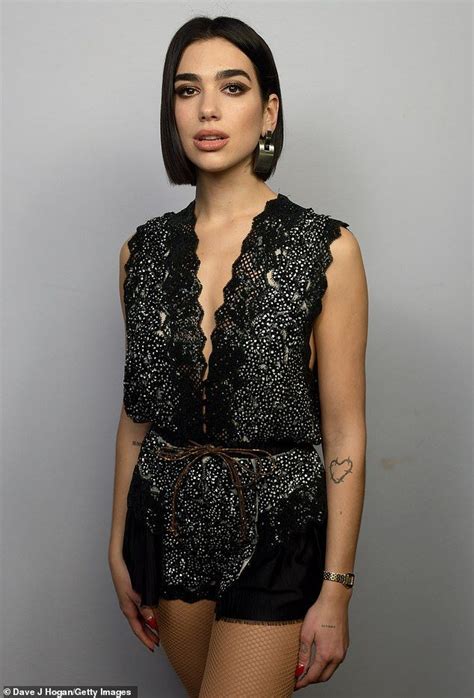 Dua Lipa puts on a sassy performance in a lace playsuit at Wembley ...