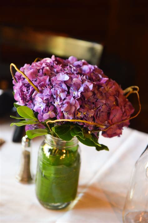 The purple Hydrangea centerpiece for Shaun's reception at the Twin Owls Steak House. Flora ...