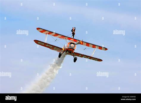 The Breitling Wing-walking aerobatics display team Stock Photo - Alamy