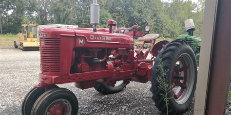 Restored McCormick in a lot : r/tractors